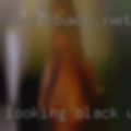 Looking black woman reading